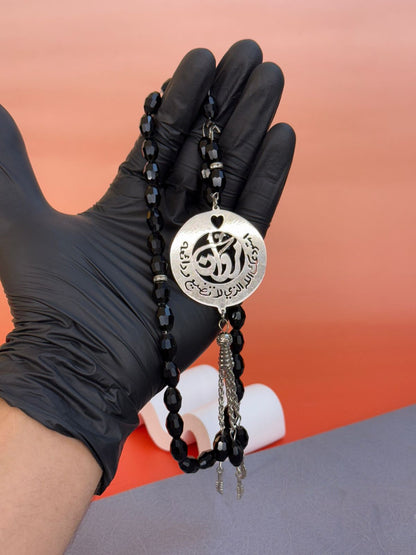 A Rosary with a religious phrase and laser engraving on the inside
